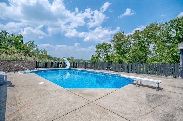 4822 W State St, Mahoning Twp Law, PA 16116 - view of pool featuring a water slide, a patio area, and a diving board