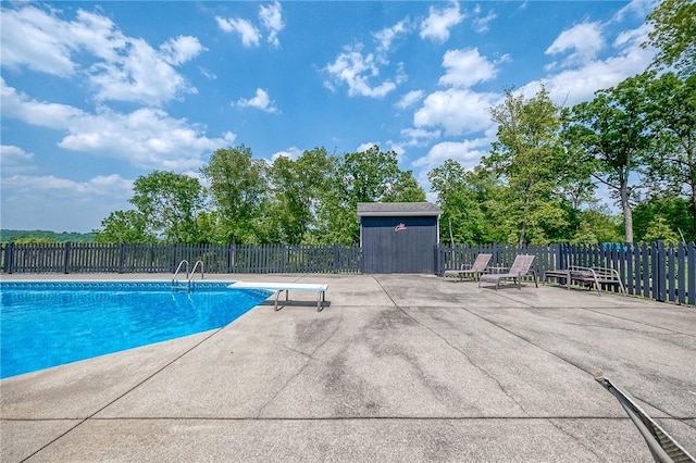 4822 W State St, Mahoning Twp Law, PA 16116 - view of pool with a patio area, a diving board, and an outdoor structure