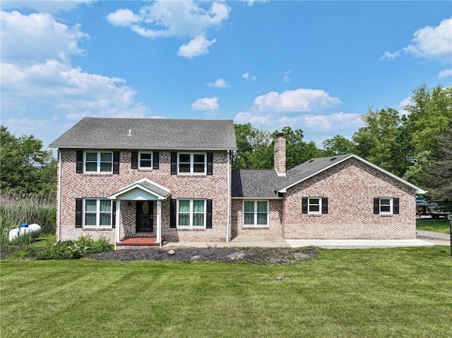 4822 W State St, Mahoning Twp Law, PA 16116 - view of front of home featuring brick siding, a chimney, and a front lawn