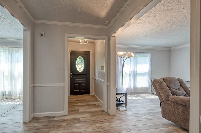 4822 W State St, Mahoning Twp Law, PA 16116 - entrance foyer with light wood-style floors, a textured ceiling, ornamental molding, and baseboards