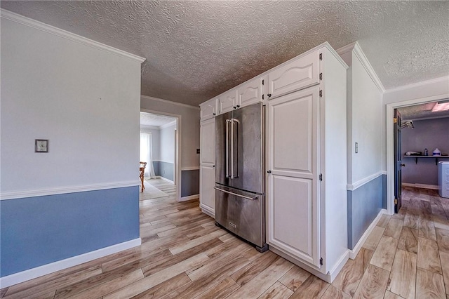 4822 W State St, Mahoning Twp Law, PA 16116 - kitchen featuring high end fridge, a textured ceiling, white cabinets, light wood-style floors, and crown molding