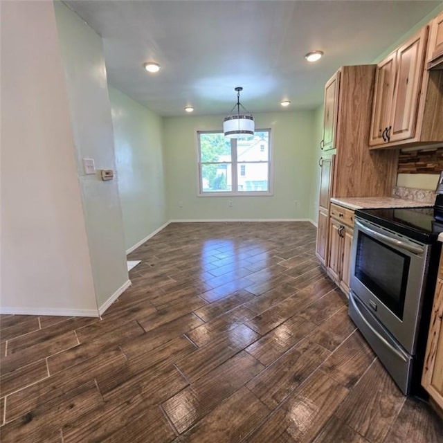 1911 Carolyn St, Farrell, PA 16121 - kitchen with electric stove, baseboards, light countertops, dark wood-type flooring, and a chandelier
