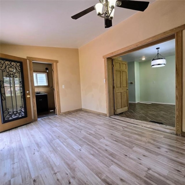 1911 Carolyn St, Farrell, PA 16121 - spare room with wood finished floors, a ceiling fan, and baseboards