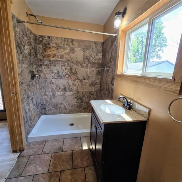 1911 Carolyn St, Farrell, PA 16121 - bathroom with vanity, tiled shower, and tile patterned flooring