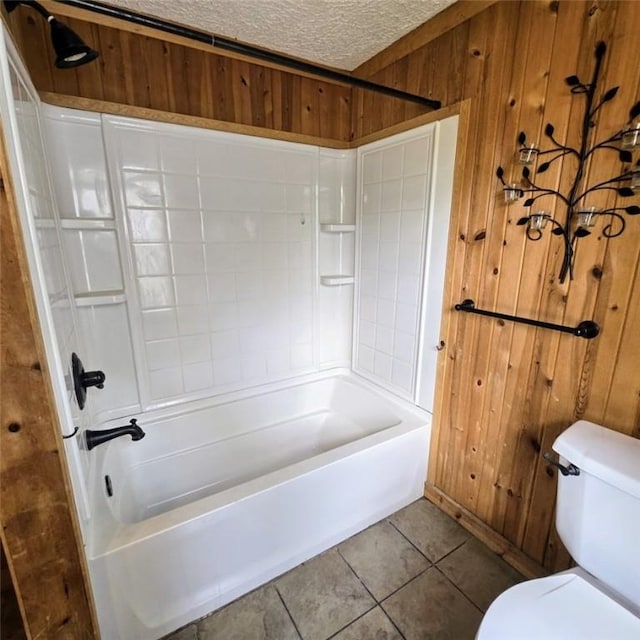 1911 Carolyn St, Farrell, PA 16121 - bathroom with toilet,  shower combination, tile patterned flooring, and wooden walls