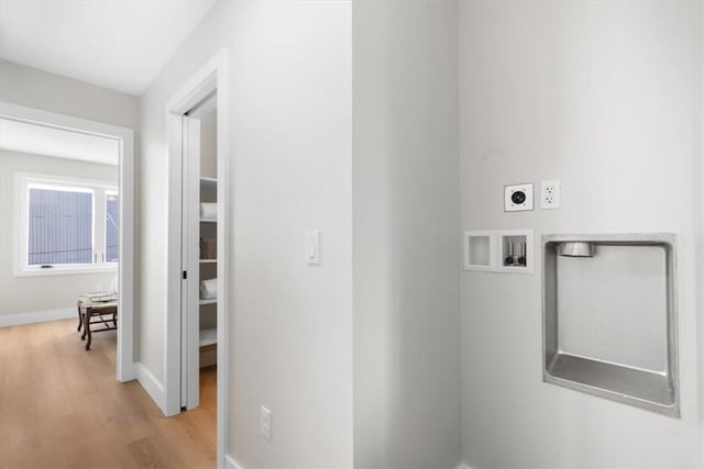 1213 Boyle St, Central North Side, PA 15212 - laundry area featuring electric dryer hookup, light wood-type flooring, hookup for a washing machine, and baseboards