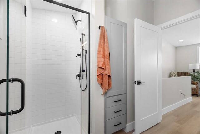 1213 Boyle St, Central North Side, PA 15212 - full bath with a stall shower, wood finished floors, and baseboards