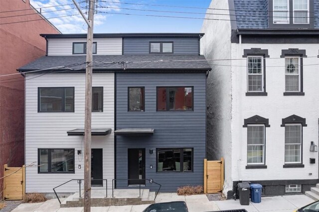1213 Boyle St, Central North Side, PA 15212 - view of front facade featuring roof with shingles and a gate