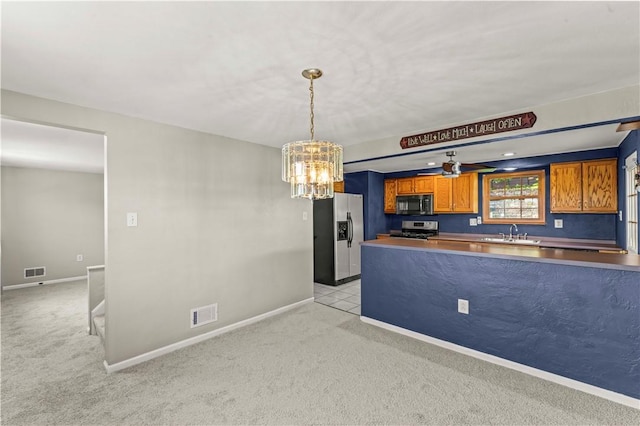 582 Brinwood Ave, Baldwin Boro, PA 15227 - kitchen featuring black microwave, stove, stainless steel refrigerator with ice dispenser, a sink, and light colored carpet