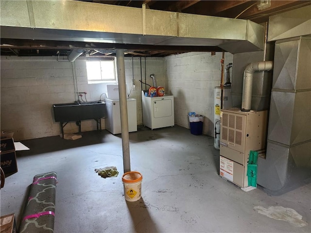 305 Charles Ter, Jeannette, PA 15644 - below grade area with washer and dryer, gas water heater, a sink, and heating unit