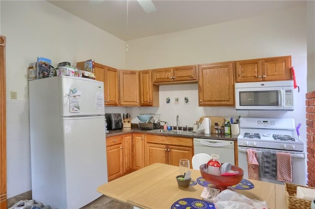 21 S Harrison Ave, Bellevue, PA 15202 - kitchen featuring white appliances, a sink, dark countertops, and a ceiling fan