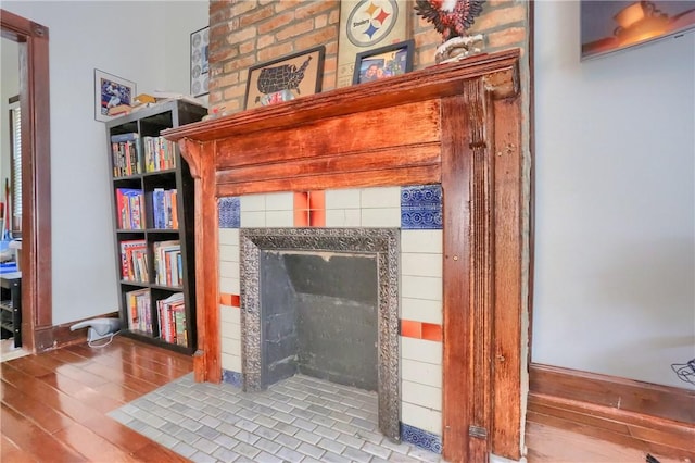 21 S Harrison Ave, Bellevue, PA 15202 - detailed view of a tiled fireplace and wood finished floors