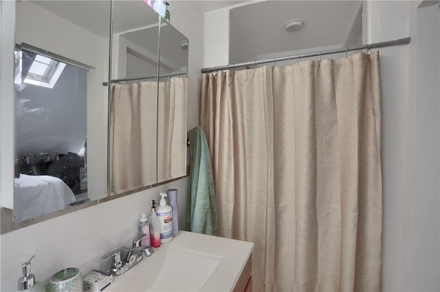 21 S Harrison Ave, Bellevue, PA 15202 - full bath with vanity, tasteful backsplash, a skylight, and a shower with shower curtain