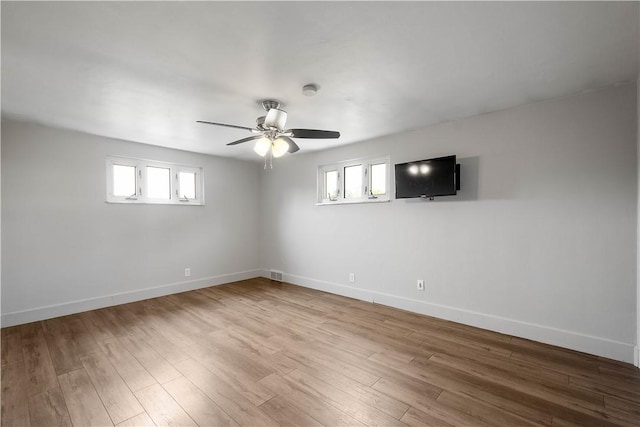 804 Division St, West Mifflin, PA 15122 - unfurnished room featuring a ceiling fan, plenty of natural light, and baseboards