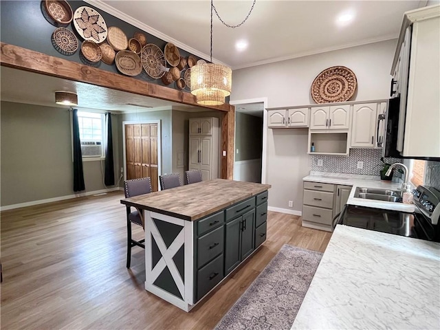 254 Bicker Rd, Winfield Twp, PA 16023 - kitchen featuring a sink, electric range oven, a chandelier, baseboards, and light wood-type flooring