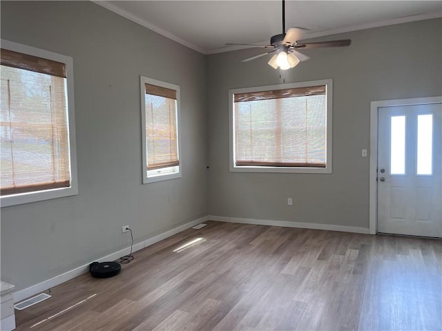 254 Bicker Rd, Winfield Twp, PA 16023 - entrance foyer with plenty of natural light, light wood finished floors, crown molding, and a ceiling fan
