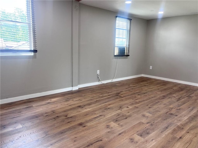254 Bicker Rd, Winfield Twp, PA 16023 - empty room featuring plenty of natural light, wood finished floors, and baseboards