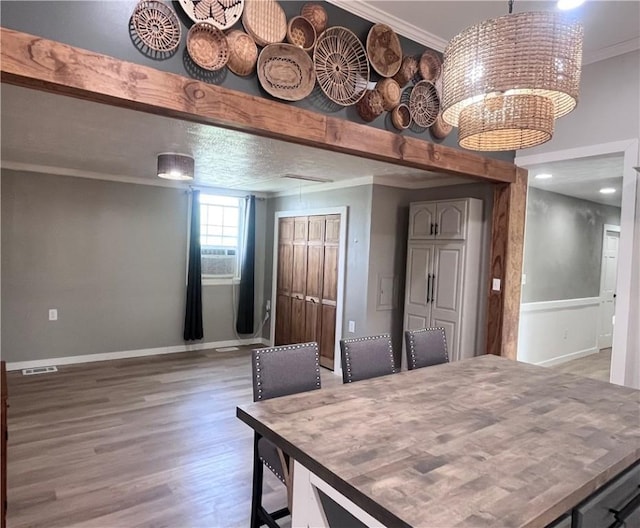 254 Bicker Rd, Winfield Twp, PA 16023 - dining room featuring light wood-type flooring, crown molding, and baseboards