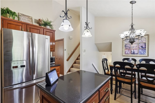 100 Welty Dr, Allegheny Twp Wml, PA 15068 - kitchen featuring stainless steel appliances, a chandelier, decorative light fixtures, a kitchen island, and light wood-type flooring
