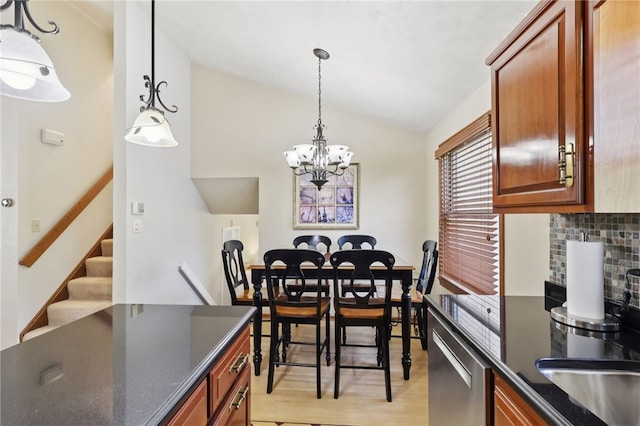 100 Welty Dr, Allegheny Twp Wml, PA 15068 - dining room featuring lofted ceiling, a chandelier, light wood-style flooring, and stairway
