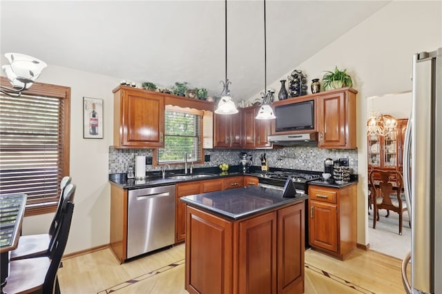 100 Welty Dr, Allegheny Twp Wml, PA 15068 - kitchen featuring appliances with stainless steel finishes, a sink, dark countertops, decorative backsplash, and lofted ceiling