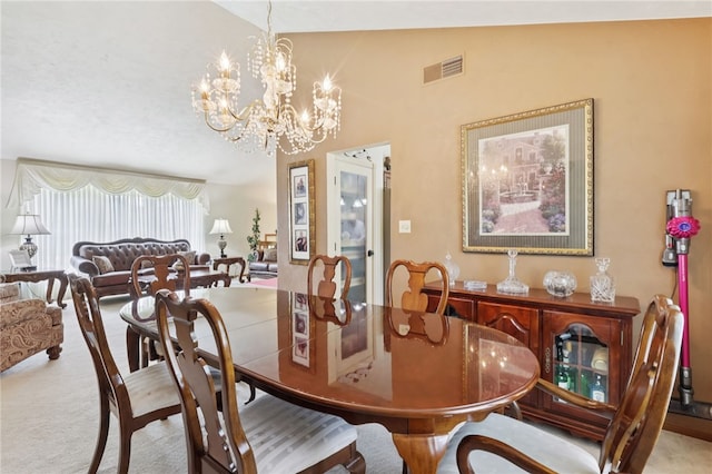 100 Welty Dr, Allegheny Twp Wml, PA 15068 - dining area featuring a chandelier, carpet, and lofted ceiling