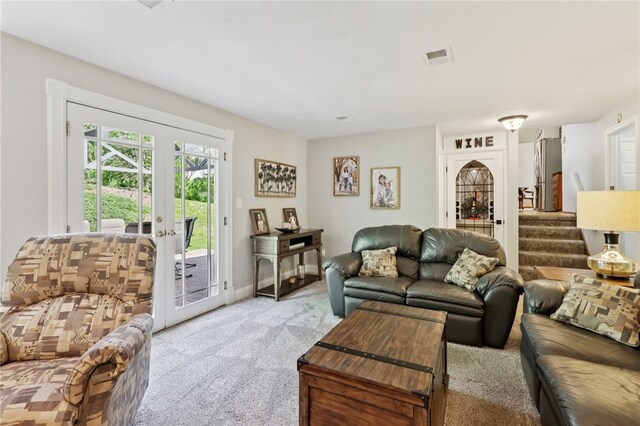 100 Welty Dr, Allegheny Twp Wml, PA 15068 - living area with french doors, light colored carpet, and stairway