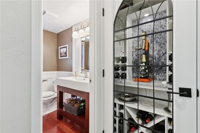 100 Welty Dr, Allegheny Twp Wml, PA 15068 - wine room featuring wood finished floors and wainscoting