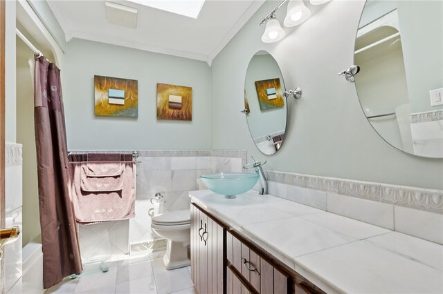 100 Welty Dr, Allegheny Twp Wml, PA 15068 - bathroom featuring crown molding, toilet, vanity, tile walls, and shower / tub combo