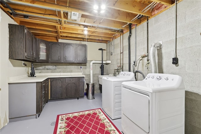 100 Welty Dr, Allegheny Twp Wml, PA 15068 - laundry area featuring washer and dryer, cabinet space, and concrete block wall