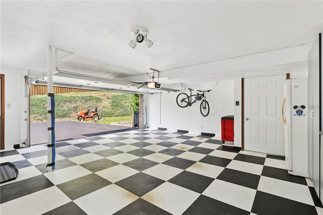 100 Welty Dr, Allegheny Twp Wml, PA 15068 - garage featuring freestanding refrigerator and a garage door opener