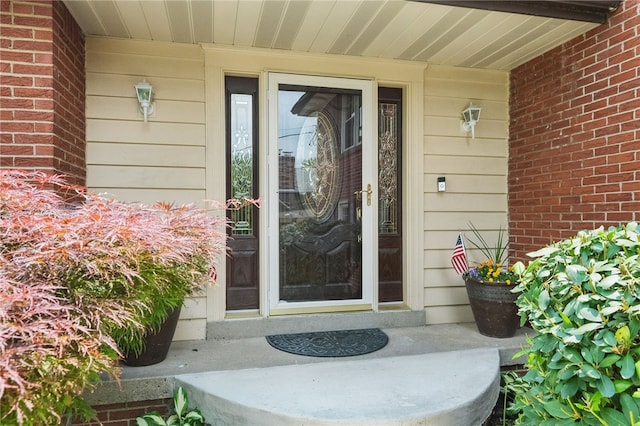 240 Patton Dr, Moon/Crescent Twp, PA 15108 - property entrance with a porch and brick siding