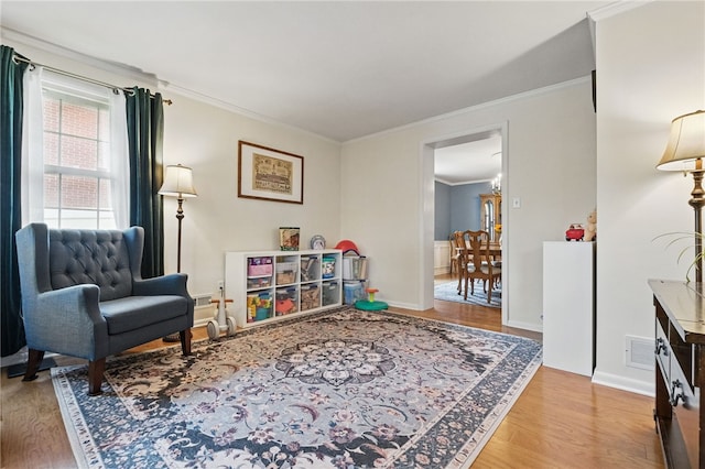 240 Patton Dr, Moon/Crescent Twp, PA 15108 - sitting room featuring crown molding, light wood finished floors, and baseboards