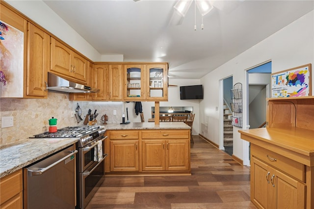 240 Patton Dr, Moon/Crescent Twp, PA 15108 - kitchen with under cabinet range hood, stainless steel appliances, dark wood-type flooring, a ceiling fan, and glass insert cabinets
