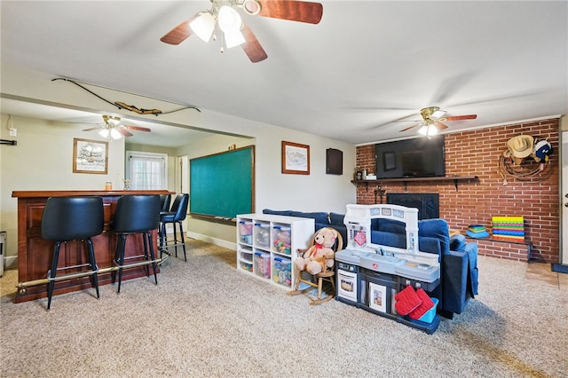 240 Patton Dr, Moon/Crescent Twp, PA 15108 - rec room with ceiling fan, carpet floors, a brick fireplace, a dry bar, and brick wall