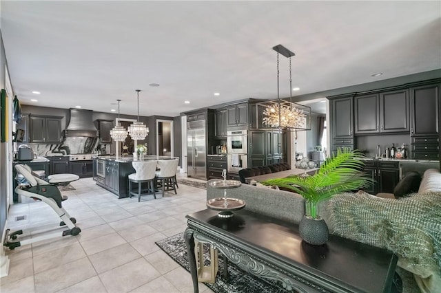 623 Oswego Dr, Adams Twp, PA 15044 - kitchen featuring stainless steel appliances, a chandelier, a kitchen bar, light tile patterned floors, and custom exhaust hood