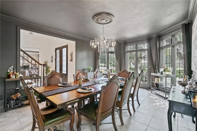 623 Oswego Dr, Adams Twp, PA 15044 - dining area featuring a chandelier, ornamental molding, light tile patterned flooring, stairway, and a textured ceiling