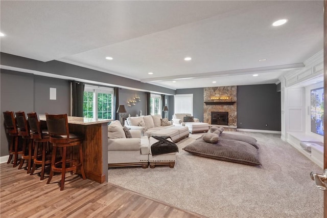 623 Oswego Dr, Adams Twp, PA 15044 - living area with wood finished floors, a bar, a fireplace, recessed lighting, and baseboards