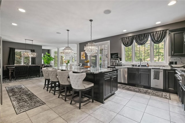 623 Oswego Dr, Adams Twp, PA 15044 - kitchen featuring a chandelier, a sink, dishwasher, light stone countertops, and recessed lighting