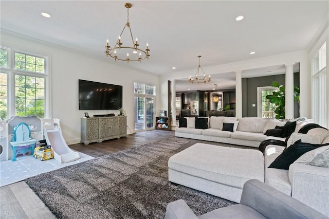 623 Oswego Dr, Adams Twp, PA 15044 - living room with a chandelier, wood finished floors, recessed lighting, crown molding, and ornate columns