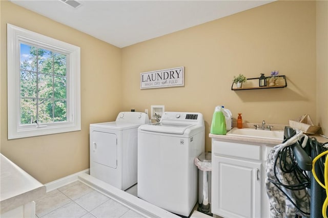 623 Oswego Dr, Adams Twp, PA 15044 - washroom with washing machine and clothes dryer, light tile patterned flooring, cabinet space, and baseboards