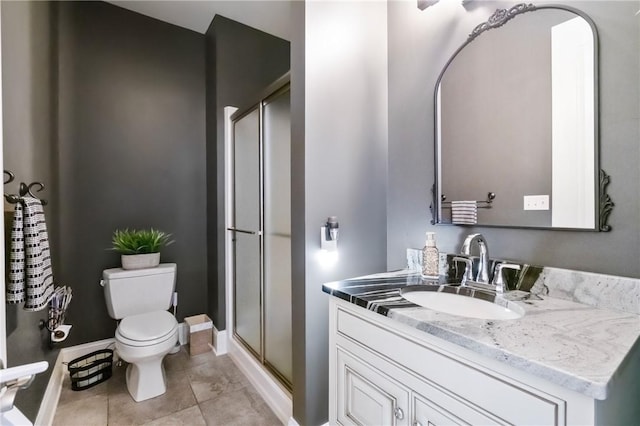 623 Oswego Dr, Adams Twp, PA 15044 - bathroom featuring a stall shower, vanity, toilet, baseboards, and tile patterned floors