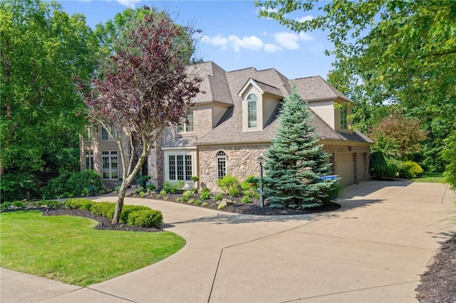 623 Oswego Dr, Adams Twp, PA 15044 - view of front of house with stone siding, concrete driveway, and a front lawn