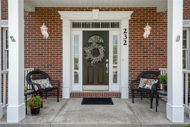 232 Crosswinds Ct, North Fayette, PA 15108 - view of exterior entry with a porch and brick siding