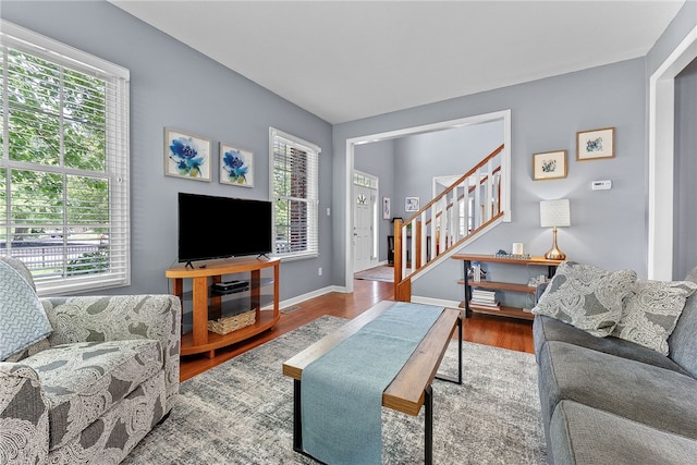 232 Crosswinds Ct, North Fayette, PA 15108 - living area featuring stairs, wood finished floors, and baseboards