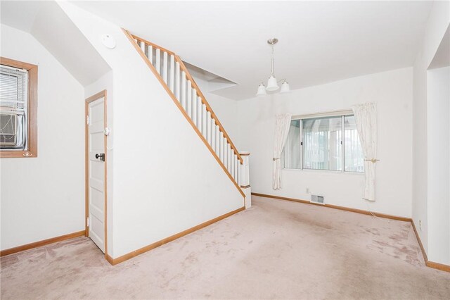 38 Locust St, Center Twp/Homer Cty, PA 15731 - unfurnished living room featuring a chandelier, carpet floors, stairs, and baseboards