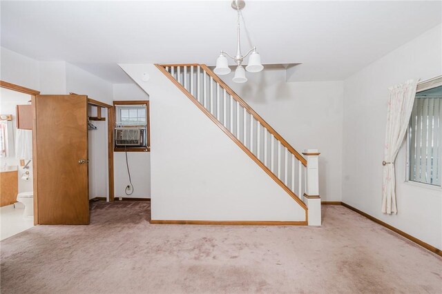 38 Locust St, Center Twp/Homer Cty, PA 15731 - unfurnished living room with a chandelier, carpet flooring, stairway, and cooling unit