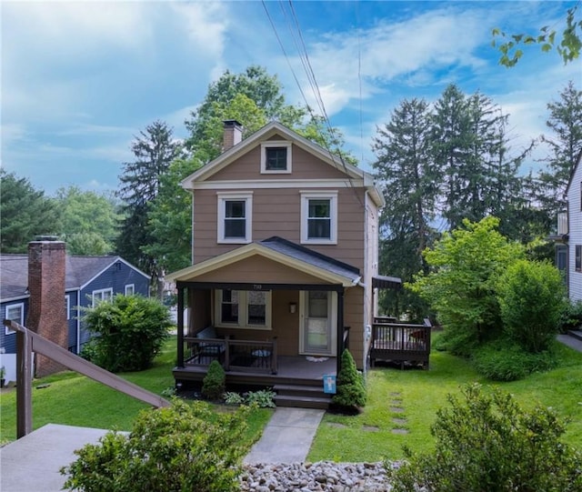 710 Beaver St, Leetsdale, PA 15056 - american foursquare style home featuring a chimney, a front lawn, and a porch