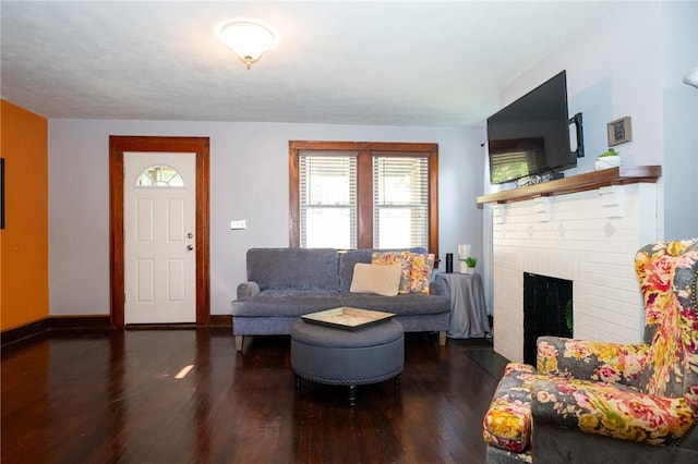 710 Beaver St, Leetsdale, PA 15056 - living room featuring wood finished floors, a brick fireplace, and baseboards