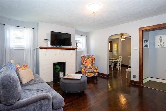 710 Beaver St, Leetsdale, PA 15056 - living room with wood finished floors, healthy amount of natural light, arched walkways, and a brick fireplace